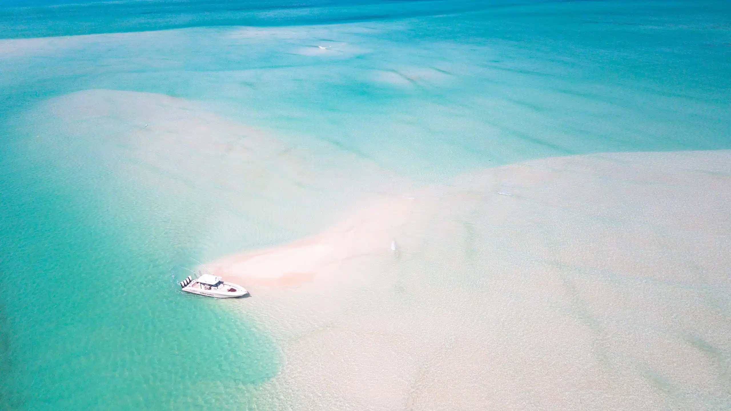 Things to Do in Turks and Caicos, an aerial image of Panoply's Marauder at a beautiful sand bar