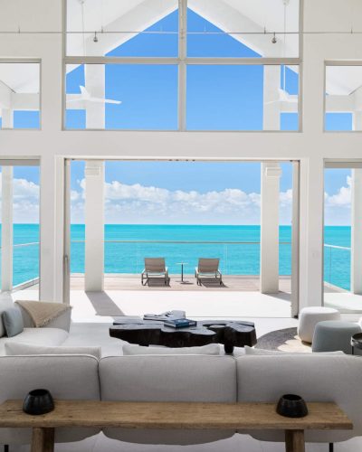 La Mer South Luxury Villa Rental Turks and Caicos. The stunning view from the living room looks out across calm turquoise waters of Sapodilla Bay.
