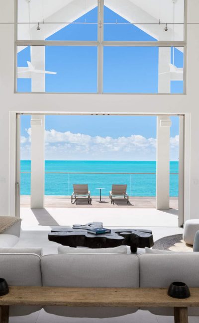 La Mer South Luxury Villa Rental Turks and Caicos. The stunning view from the living room looks out across calm turquoise waters of Sapodilla Bay.