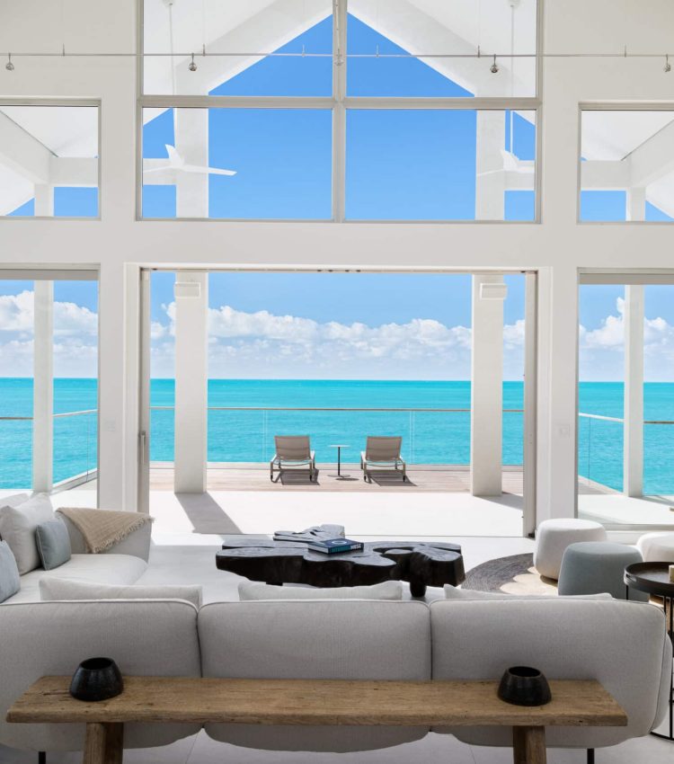 La Mer South Luxury Villa Rental Turks and Caicos. The stunning view from the living room looks out across calm turquoise waters of Sapodilla Bay.