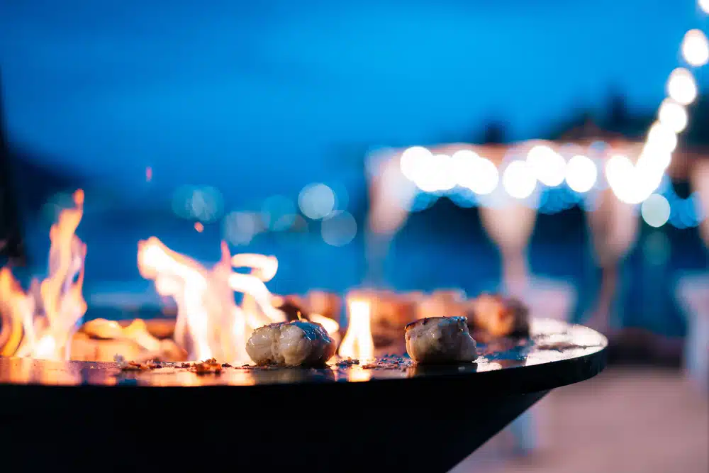 Private chef Ofyr experience, cooking scallops on the specialty grill
