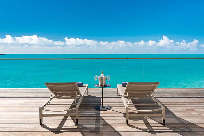 Loungers overlooking Sapodilla Bay on La Mer Villa South second level terrace