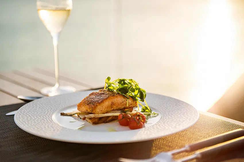 Private Chef prepared gourmet meal at sunset over Sapodilla Bay